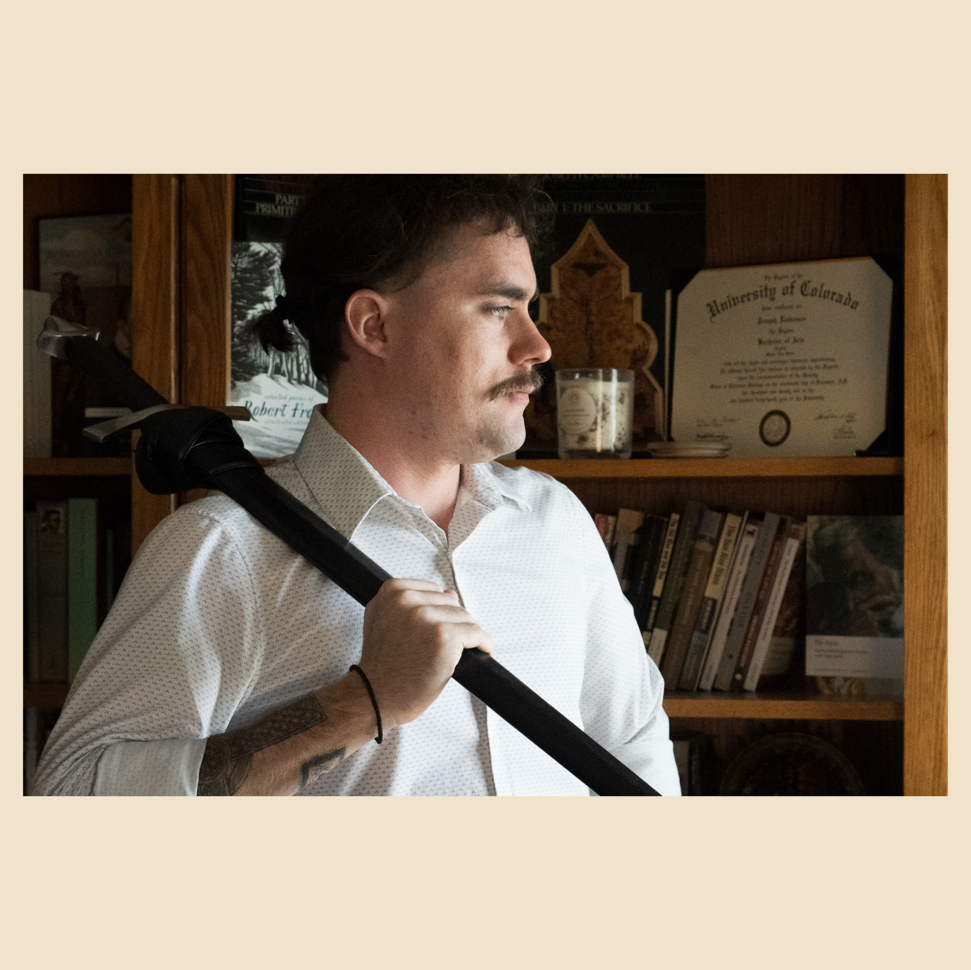 Joseph Eldredge in profile, holding a staff